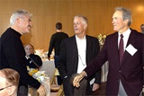 Feature Film Award Nominee Gary Ross greets fellow nominee Clint Eastwood as DGA President Michael Apted (center) looks on.