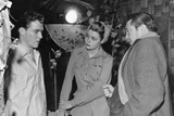 Vincent Sherman (right) directs actors Richard Todd and Patricia Neal through a scene in the The Hasty Heart, at Elstree Studios in 1949. 