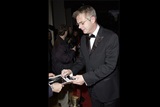 Stephen Daldry signs an autograph for a fan of The Hours.