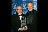 Scorsese and Spielberg pose backstage with DGA Lifetime Achievement Award trophy.