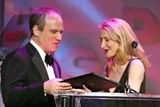 Patricia Clarkson presents the Outstanding Directing in Documentary award to Nathaniel Kahn.