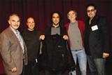 DGA Latino Committee Co-Chairs A. P. Gonzalez, Gabe Torres, Jay Torres (right) and moderator Curtis Hanson, present a commemorative jacket to Iñárritu.
