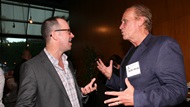 Director Guy Ferland chats with actor-director Peter Weller at the reception.