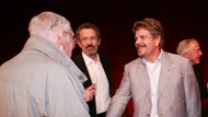 Director Robert Butler is greeted by moderator Thomas Schlamme and producer John Wells.